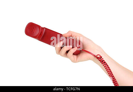Handset of red phone in hand isolated on white Stock Photo