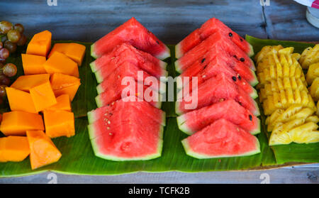 Fresh watermelon sliced, pineapple and papaya for breakfast. Stock Photo
