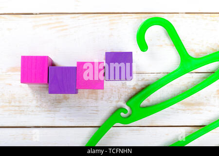 clothing hanger on the wooden table Stock Photo