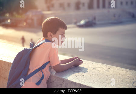 Back to school first day kid carrying backpack walking up school stairs Stock Photo