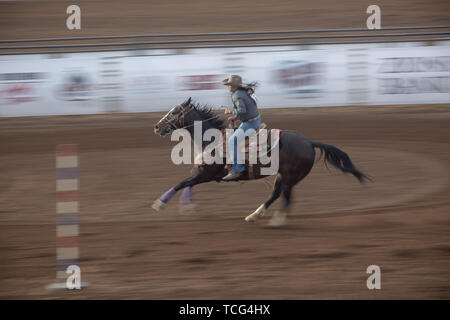 Heber City, Utah, USA. 7th June, 2019. A woman rider takes part in the pole bending event at the Utah High School Rodeo Association Finals in Heber City Utah, June 7, 2019. Students from across the state of Utah gathered to compete in Barrel Racing, Pole Bending, Goat Tying, Breakaway Roping, Cow Cutting, Bull Riding, Bareback Riding, Saddle Bronc Riding, Tie Down Roping, Steer Wrestling, and Team Roping. Credit: Natalie Behring/ZUMA Wire/Alamy Live News Stock Photo