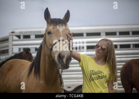 Heber City, Utah, USA. 7th June, 2019. a young woman with her horse at the Utah High School Rodeo Association Finals in Heber City Utah, June 7, 2019. Students from across the state of Utah gathered to compete in Barrel Racing, Pole Bending, Goat Tying, Breakaway Roping, Cow Cutting, Bull Riding, Bareback Riding, Saddle Bronc Riding, Tie Down Roping, Steer Wrestling, and Team Roping. Credit: Natalie Behring/ZUMA Wire/Alamy Live News Stock Photo