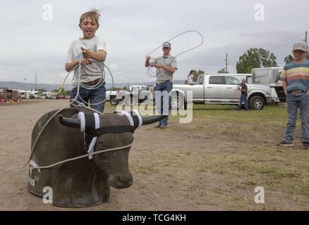 Heber City, Utah, USA. 7th June, 2019. Boys and young men practice roping in the parking lot of the Utah High School Rodeo Association Finals in Heber City Utah, June 7, 2019. Students from across the state of Utah gathered to compete in Barrel Racing, Pole Bending, Goat Tying, Breakaway Roping, Cow Cutting, Bull Riding, Bareback Riding, Saddle Bronc Riding, Tie Down Roping, Steer Wrestling, and Team Roping. Credit: Natalie Behring/ZUMA Wire/Alamy Live News Stock Photo