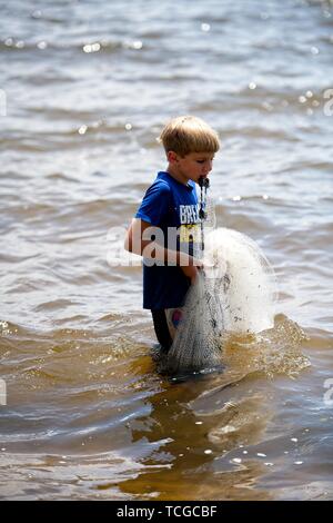 Boy throwing cast net hi-res stock photography and images - Alamy
