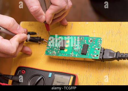 Repair of electronic board Stock Photo