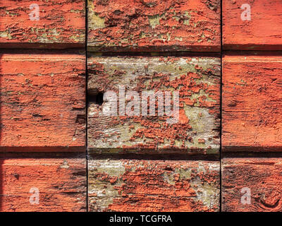 Close up image of red weathered color on a wooden plank Stock Photo
