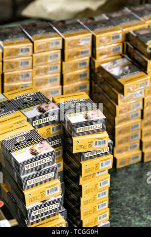 A stack of Cohiba cigarillos waiting for shrink wrap at the Santa Clara cigar factory in San Andres Tuxtlas, Veracruz, Mexico. The factory produces the Cuba Cohiba brand products under license for distribution to countries that ban Cuban products from import. Stock Photo