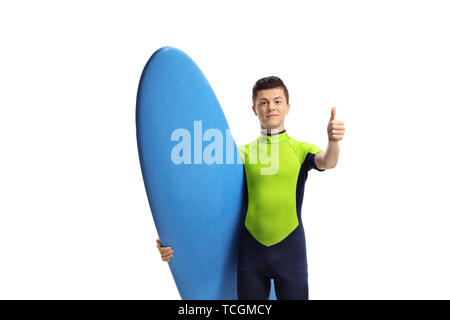 Young male surfer with a surfboard making a thumb up gesture isolated on white background Stock Photo
