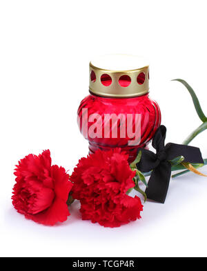 Memory lantern with candle,  carnations and black ribbon isolated on white Stock Photo