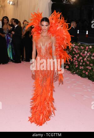 kendall jenner orange feather dress Kendall Jenner really took the 2019 'Camp: Notes on Fashion' Met Gala theme  and ran with it  Kendall showed up on the red carpet wearing a  sleeveless, luminous orange dress, that
