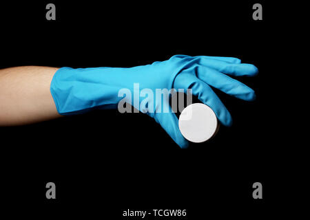 Uranium in hand isolated on black Stock Photo