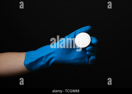 Uranium in hand isolated on black Stock Photo