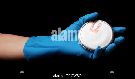 Uranium in hand isolated on black Stock Photo