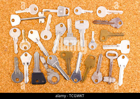 Keys on cork background Stock Photo