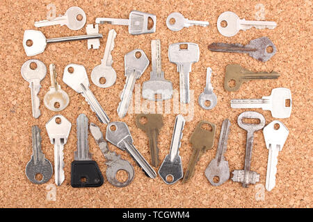 Keys on cork background Stock Photo