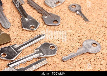 Keys on cork background Stock Photo