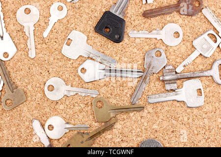 Keys on cork background Stock Photo