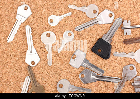 Keys on cork background Stock Photo