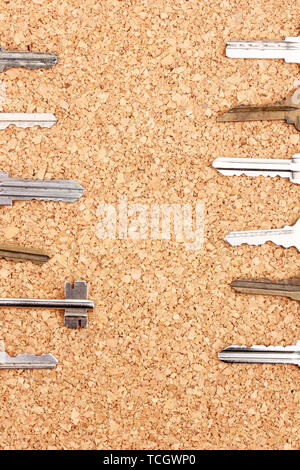 Keys on cork background Stock Photo