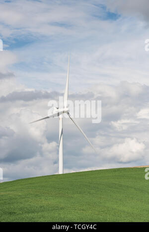 Daytime image of wind turbines in the rolling hills of the Palouse wheat farming region of Washington State USA Stock Photo