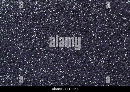 Silver sparkling background from small sequins, closeup. Brilliant shiny backdrop from textile. Shimmer gray paper Stock Photo