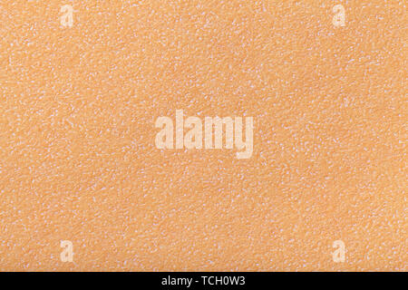 Texture of old light coral paper closeup. Structure of a dense cardboard. The orange background. Stock Photo