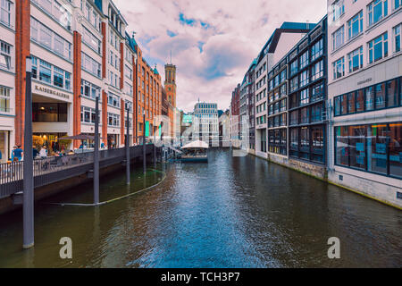 HAMBURG, GERMANY - May 31, 2019: Unidentified pedestrants populate walkways and scenic cafes and bars along famous Bleichensteg in the downtown area Stock Photo