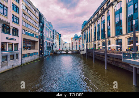 HAMBURG, GERMANY - May 31, 2019: Unidentified pedestrants populate walkways and scenic cafes and bars along famous Bleichensteg in the downtown area Stock Photo