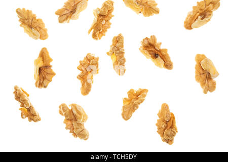 Peeled (open) nuts falling. Isolated on white background. Stock Photo