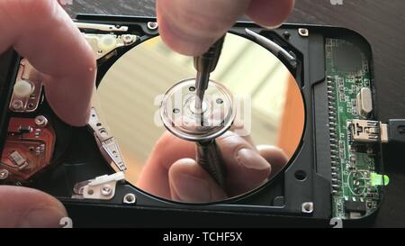 fixing an open hard drive broken with stuck head. Stock Photo
