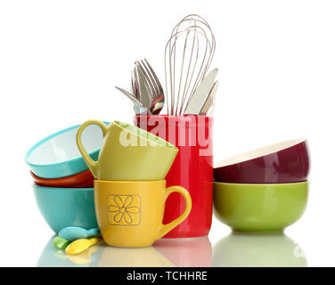 bright empty bowls, cups and kitchen utensils isolated on white Stock Photo