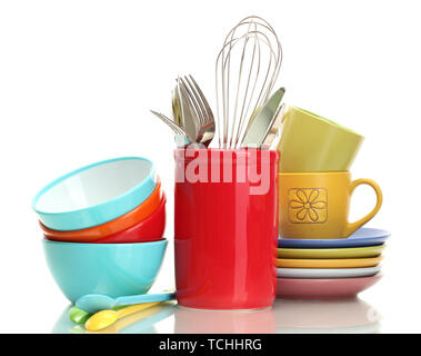 bright empty bowls, cups and kitchen utensils isolated on white Stock Photo