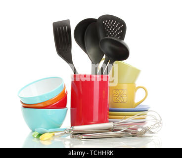 bright empty bowls, cups and kitchen utensils isolated on white Stock Photo