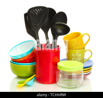 bright empty bowls, cups and kitchen utensils isolated on white Stock Photo