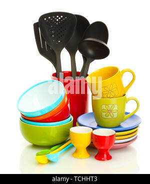 bright empty bowls, cups and kitchen utensils isolated on white Stock Photo