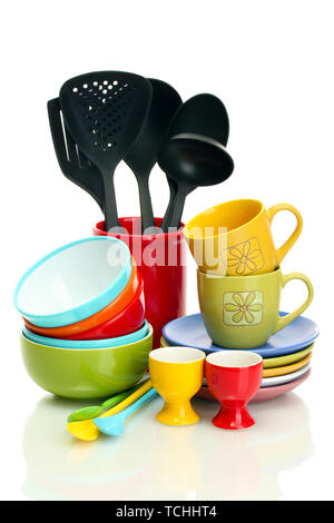 bright empty bowls, cups and kitchen utensils isolated on white Stock Photo