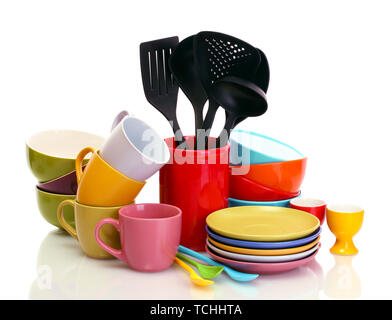 bright empty bowls, cups and kitchen utensils isolated on white Stock Photo
