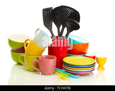 bright empty bowls, cups and kitchen utensils isolated on white Stock Photo