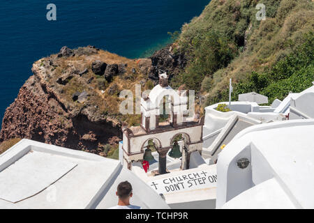 Do not step sign on roof of church in Santorini Stock Photo