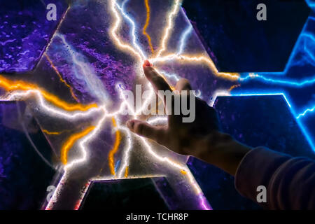 Woman touching plasma panel display Stock Photo