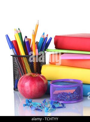 Composition of books, stationery and an apple isolated on white close-up Stock Photo