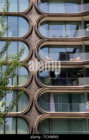 A closed up view of 520 West 28th Street, a luxury apartment building designed by Zaha Hadid next to the High line Park.Manhattan.New York City.USA Stock Photo