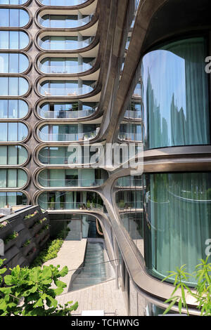 A closed up view of 520 West 28th Street, a luxury apartment building designed by Zaha Hadid next to the High line Park.Manhattan.New York City.USA