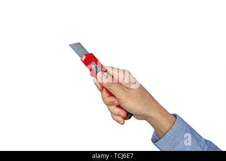 Male hands holding red sharp box cutter. Isolated on white background. Closeup. Stock Photo