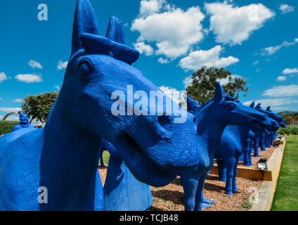 Azeitao, Lisbon, Portugal - June 7, 2019: Bright blue Xian terracotta army pieces decorating a park at Bacalhoa vineyards in Azeitao, Portugal Stock Photo
