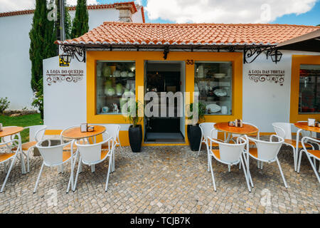 Azeitao, Portugal - June 7, 2019: Shopfront selling local products such as cake, cheese and wine built in traditional Portuguese architecture in the v Stock Photo