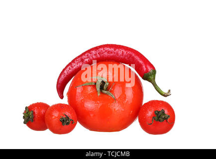 Red chili peppers with red tomatoes isolated on the white background Stock Photo