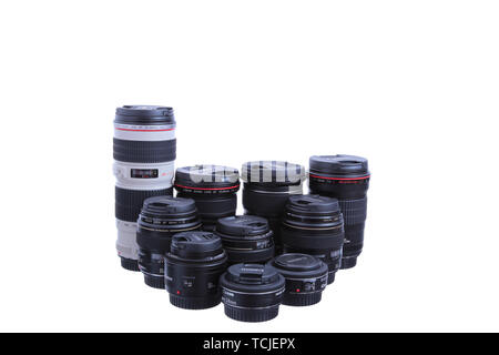 KYIV, UKRAINE - JULY 10, 2015: Set of Canon EF lenses containing a 8-15mm fish-eye, a 16-35mm, a 50mm, a 100mm Macro lens, a 24-70mm zoom lens and a 7 Stock Photo