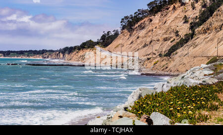 The dramatic Pacific Ocean coastline close to Santa Cruz, California; the scenic Highway 1 and eroded cliffs visible on the right Stock Photo