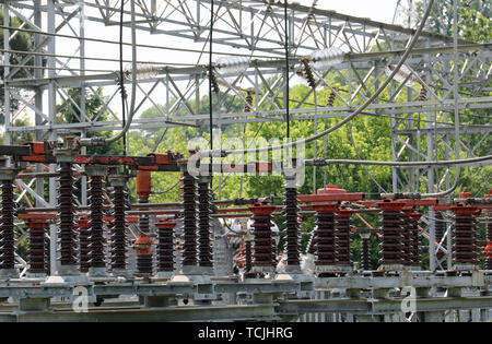 many big industrial breakers and high voltage switches in the power station Stock Photo